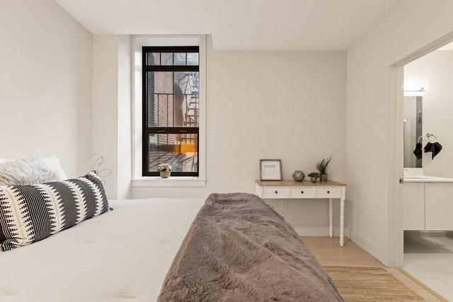 bedroom featuring light wood-type flooring