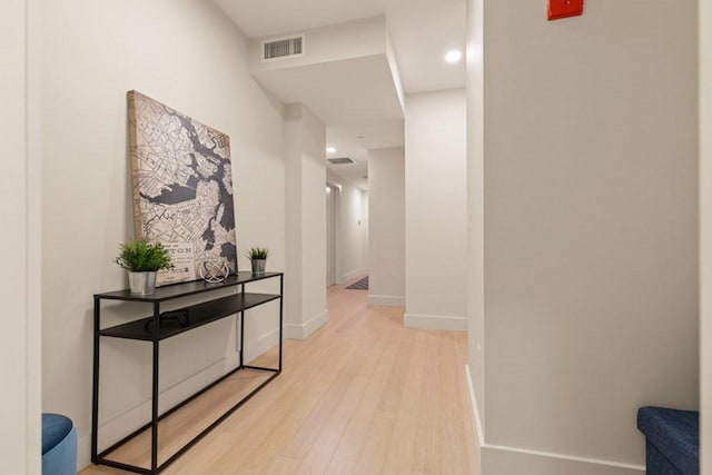 corridor featuring light hardwood / wood-style floors