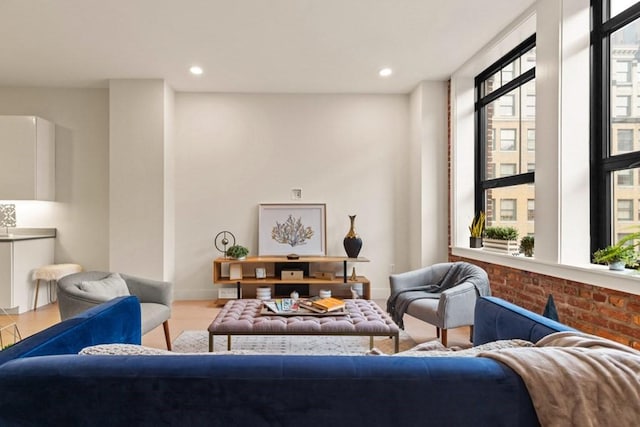 living room featuring wood-type flooring and plenty of natural light