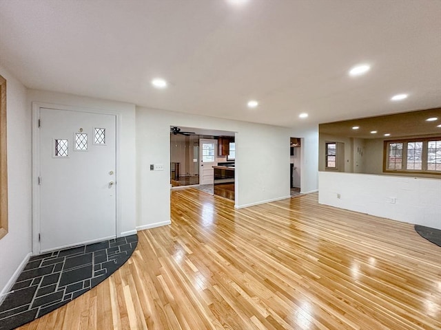 foyer entrance featuring ceiling fan and hardwood / wood-style flooring