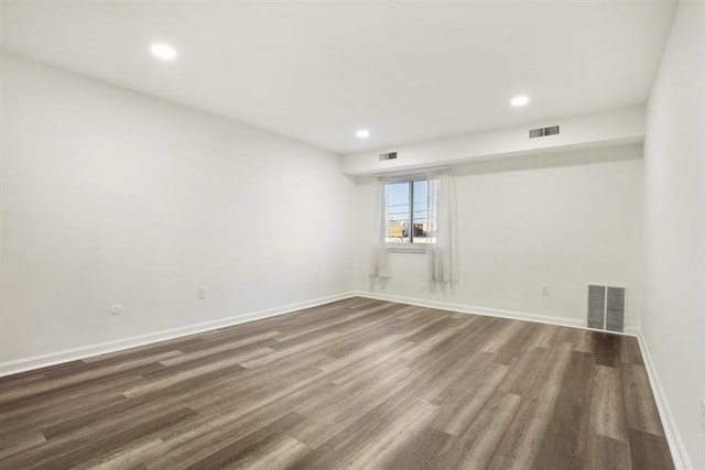 empty room featuring dark hardwood / wood-style floors