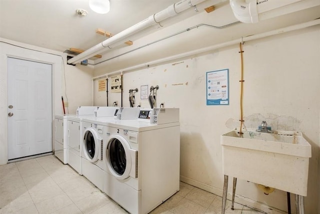 washroom featuring sink and independent washer and dryer