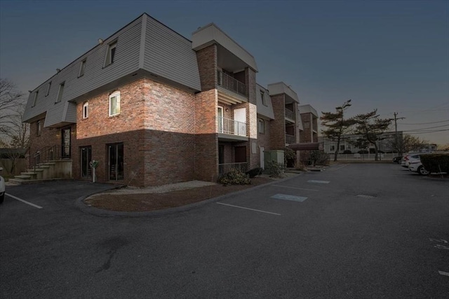 view of outdoor building at dusk