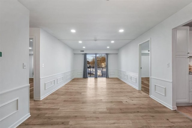 spare room with light wood-type flooring