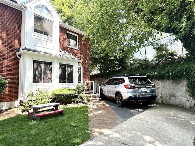 12 Cozy St Unit 12, Watertown, MA 02472 - view of parking featuring concrete driveway