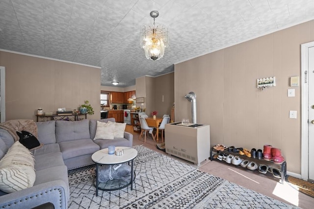 living room featuring light colored carpet and an inviting chandelier