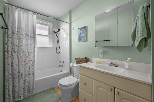 bathroom featuring vanity, toilet, and shower / bath combo with shower curtain