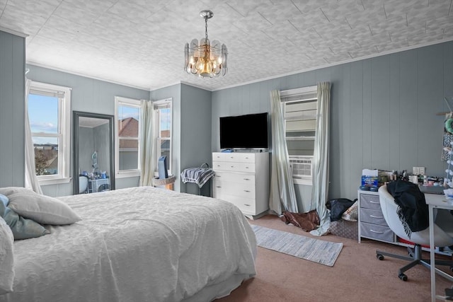 carpeted bedroom featuring cooling unit, an inviting chandelier, and ornamental molding