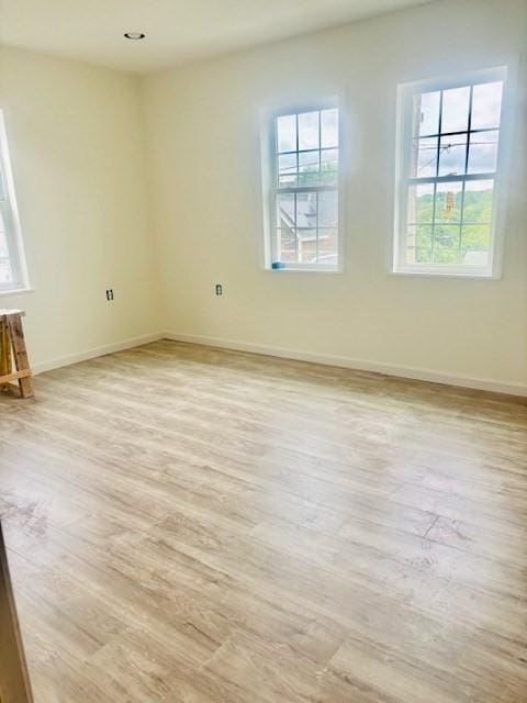 70 Preston St, Marlborough, MA 01752 - unfurnished room featuring healthy amount of natural light, light wood finished floors, and baseboards