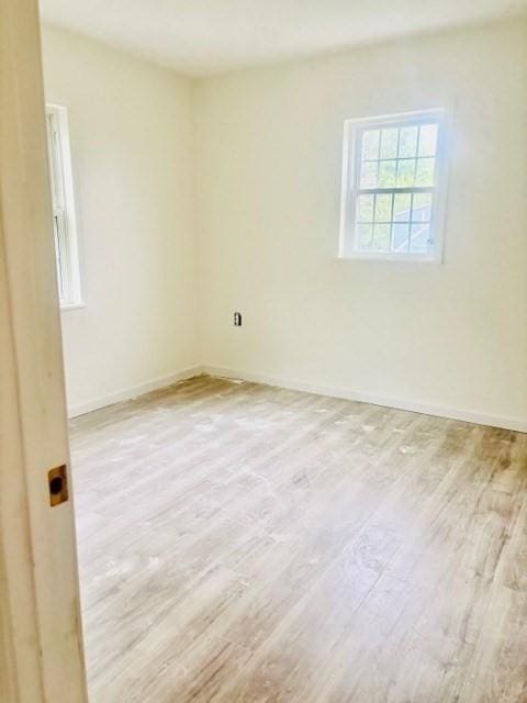 70 Preston St, Marlborough, MA 01752 - empty room with wood finished floors and baseboards
