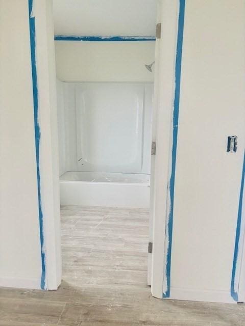 70 Preston St, Marlborough, MA 01752 - bathroom with wood finished floors and shower / washtub combination