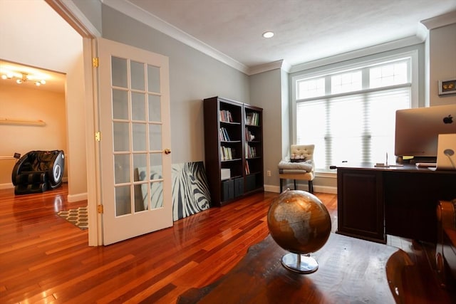 office featuring baseboards, ornamental molding, and wood finished floors