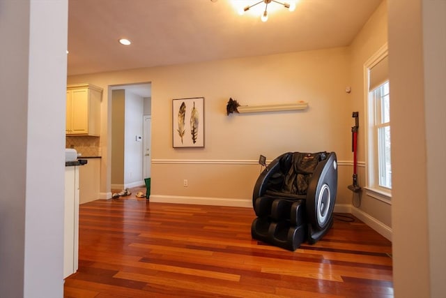 sitting room featuring a wealth of natural light, hardwood / wood-style flooring, and baseboards