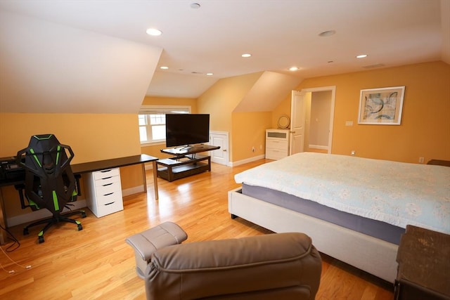 bedroom with vaulted ceiling, light wood finished floors, baseboards, and recessed lighting