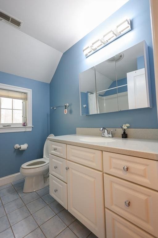 full bathroom featuring tile patterned flooring, toilet, vanity, visible vents, and vaulted ceiling