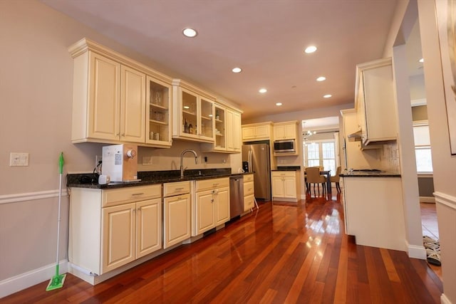 kitchen with dark wood-style floors, stainless steel appliances, baseboards, and recessed lighting