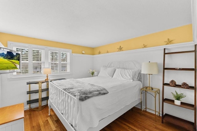 bedroom featuring wood finished floors