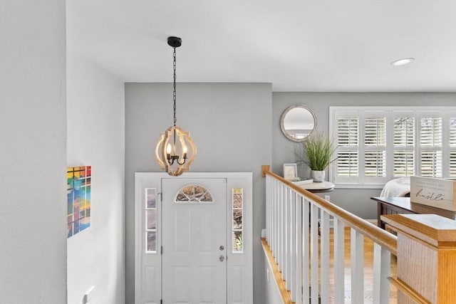 foyer with a notable chandelier and recessed lighting