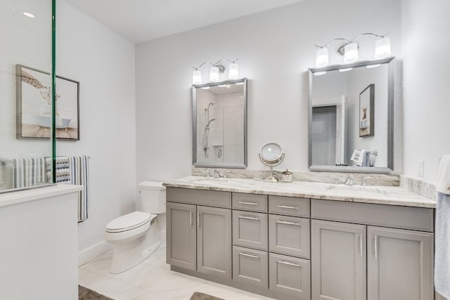 51 Tinkers Blf Unit 51, Plymouth, MA 02360 - bathroom featuring toilet, double vanity, a tile shower, and marble finish flooring