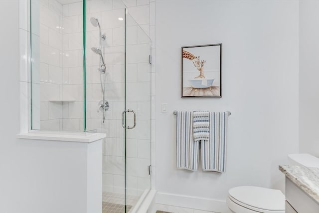51 Tinkers Blf Unit 51, Plymouth, MA 02360 - full bathroom featuring vanity, toilet, a stall shower, and baseboards