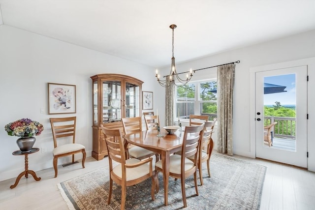 51 Tinkers Blf Unit 51, Plymouth, MA 02360 - dining area featuring a chandelier, light wood-type flooring, and baseboards