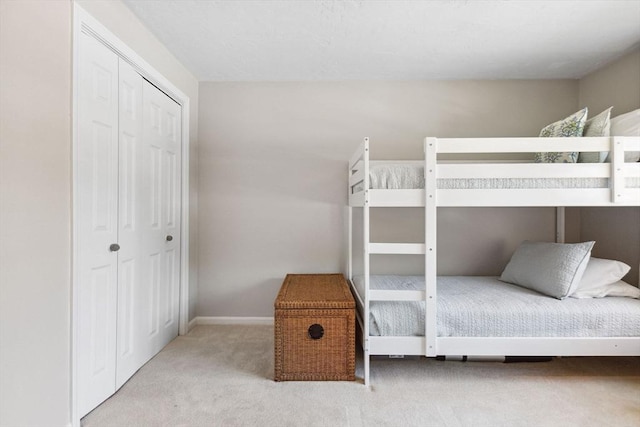 2 Englewood Dr Unit F-6, Harwich, MA 02645 - carpeted bedroom featuring a closet and baseboards