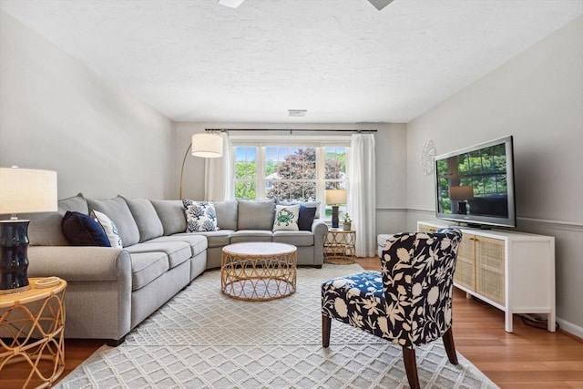 2 Englewood Dr Unit F-6, Harwich, MA 02645 - living room featuring wood finished floors and a textured ceiling