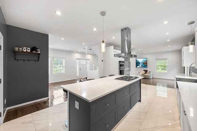 24 Clark St, Taunton, MA 02780 - kitchen featuring open floor plan, island exhaust hood, appliances with stainless steel finishes, light countertops, and baseboards