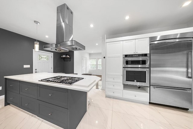 24 Clark St, Taunton, MA 02780 - kitchen with appliances with stainless steel finishes, white cabinetry, light marble finish floors, island range hood, and recessed lighting