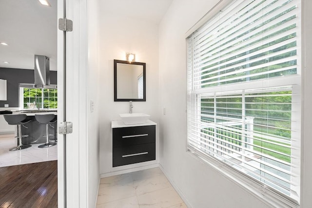 24 Clark St, Taunton, MA 02780 - bathroom with vanity, baseboards, marble look tiles, and recessed lighting
