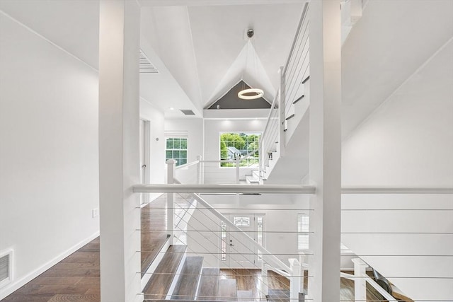 24 Clark St, Taunton, MA 02780 - staircase with baseboards, lofted ceiling, and wood finished floors