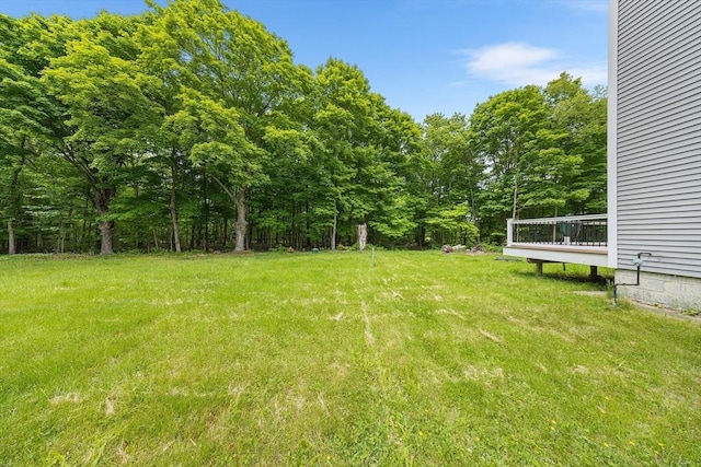 24 Clark St, Taunton, MA 02780 - view of grassy yard with a deck