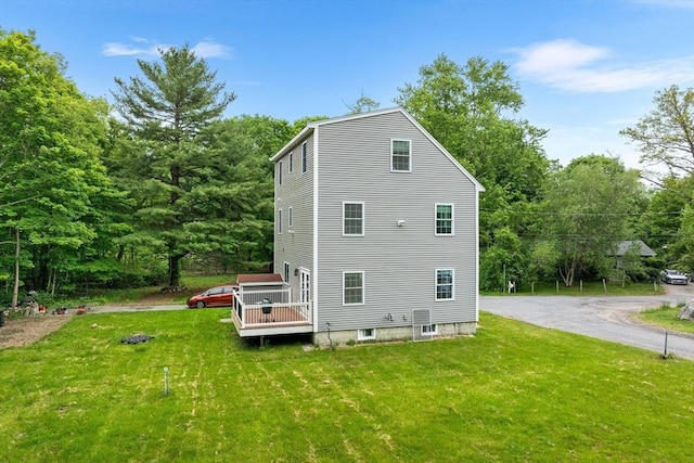 24 Clark St, Taunton, MA 02780 - rear view of house with a lawn and a wooden deck
