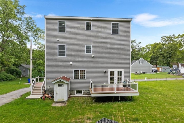 24 Clark St, Taunton, MA 02780 - back of property featuring a deck, a yard, stairs, and french doors