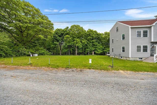 24 Clark St, Taunton, MA 02780 - view of side of property with a lawn