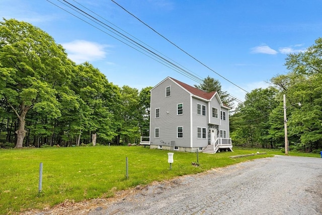 24 Clark St, Taunton, MA 02780 - view of side of home with a lawn