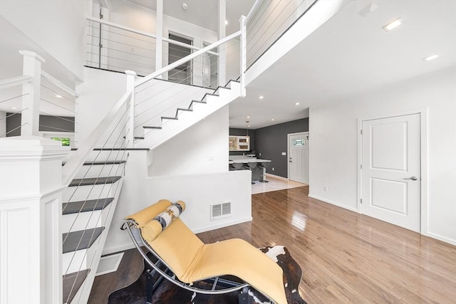 24 Clark St, Taunton, MA 02780 - stairs with wood finished floors, baseboards, and recessed lighting
