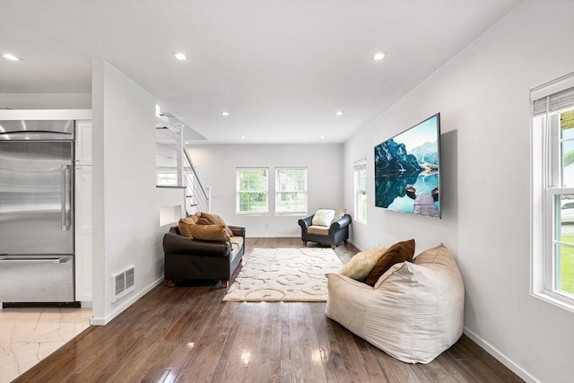 24 Clark St, Taunton, MA 02780 - living area featuring baseboards, plenty of natural light, stairway, and recessed lighting