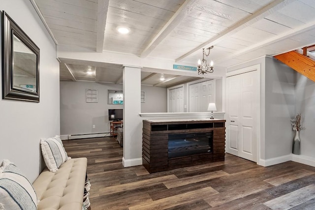 22 Tenney St, Georgetown, MA 01388 - living area with a baseboard radiator, wood finished floors, a wood ceiling with exposed beams, a fireplace, and a chandelier