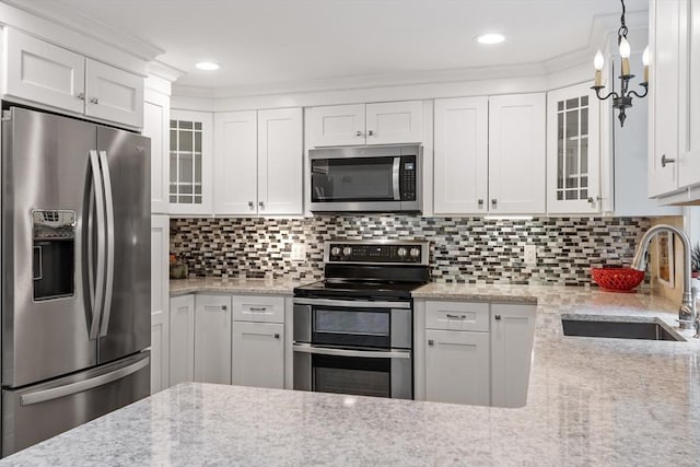 22 Tenney St, Georgetown, MA 01388 - kitchen featuring stainless steel appliances, light stone countertops, glass insert cabinets, white cabinetry, and recessed lighting