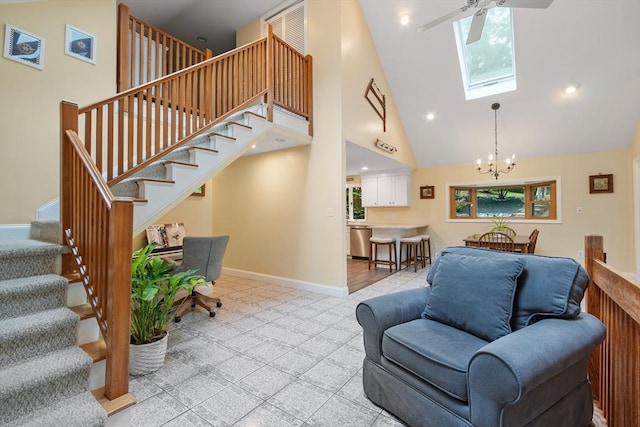 22 Tenney St, Georgetown, MA 01388 - living area featuring high vaulted ceiling, stairs, a skylight, a chandelier, and a ceiling fan