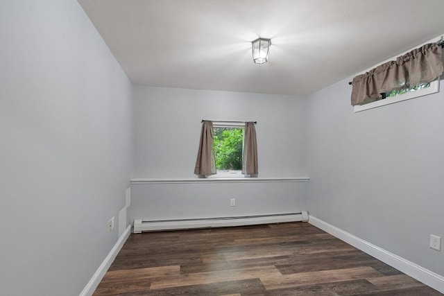 22 Tenney St, Georgetown, MA 01388 - spare room with a baseboard heating unit and wood finished floors