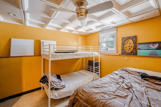 bedroom featuring coffered ceiling, ceiling fan, and light tile patterned floors