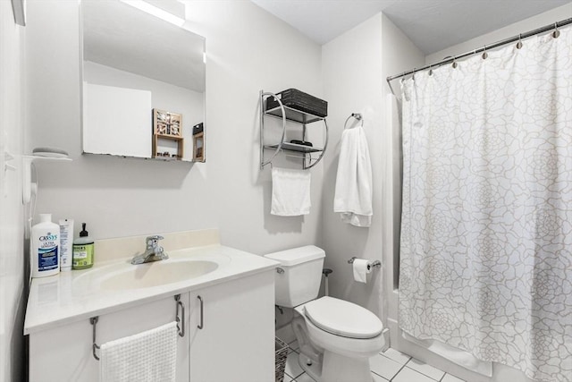 full bathroom featuring tile patterned floors, vanity, toilet, and shower / tub combo