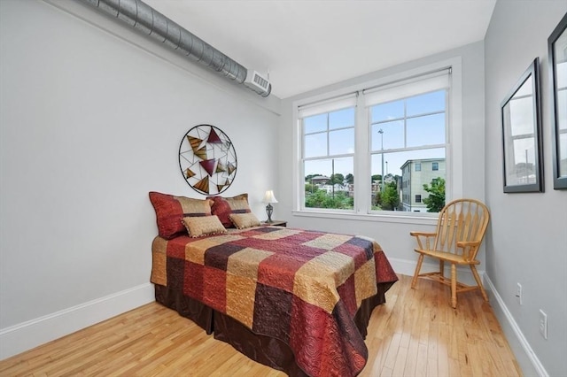 bedroom featuring hardwood / wood-style floors