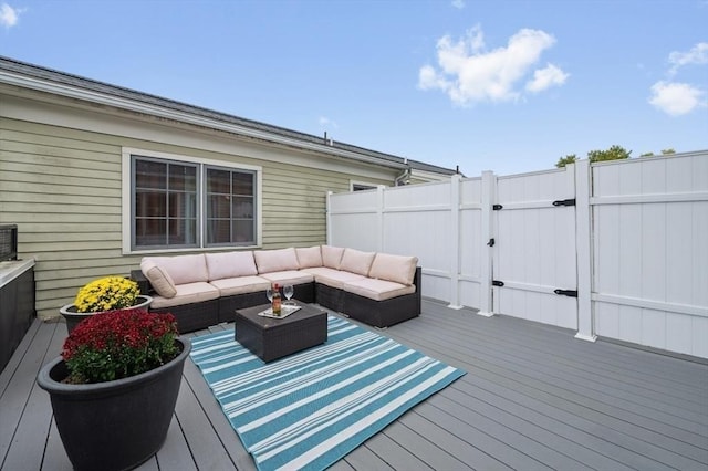 wooden deck with an outdoor living space