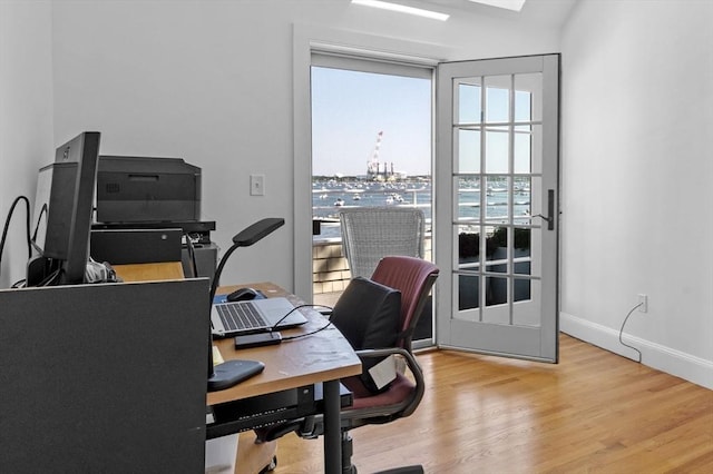 office area with wood finished floors and baseboards