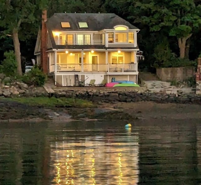 rear view of house featuring a balcony