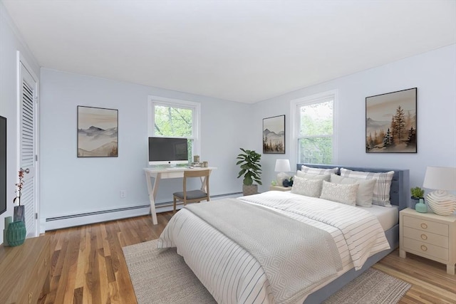 6 Post Gate Rd, Danvers, MA 01923 - bedroom with multiple windows, light wood-style flooring, and a baseboard heating unit
