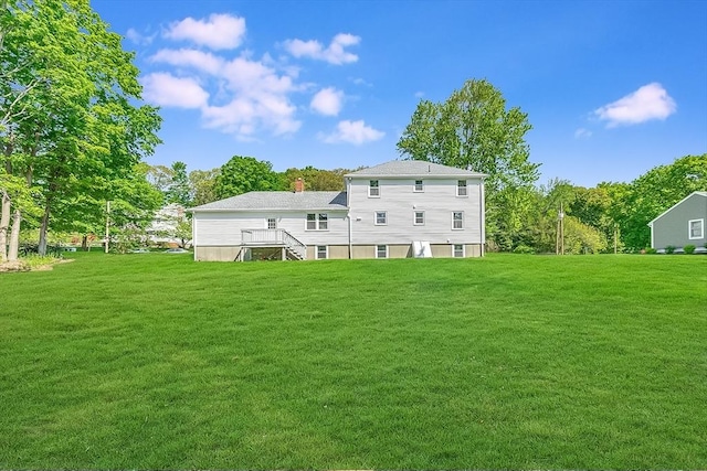 6 Post Gate Rd, Danvers, MA 01923 - rear view of house with a yard, a chimney, and view of scattered trees